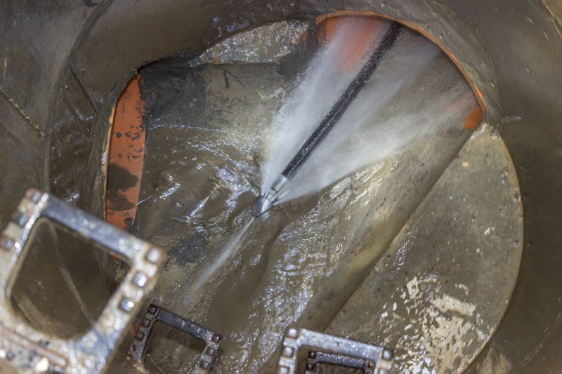 Cleaning a sewer line.